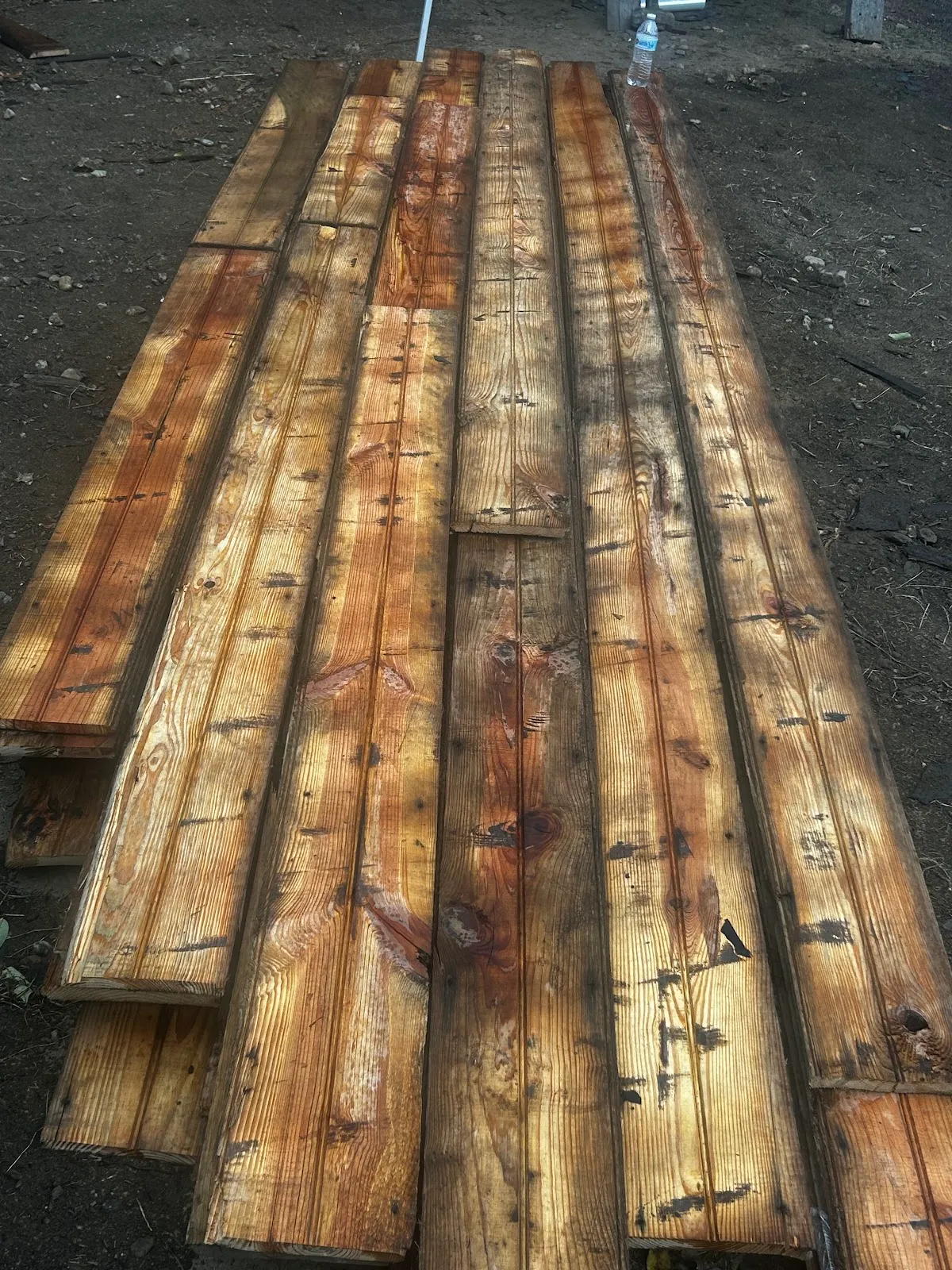 Reclaimed brown boards laid out to show their long grain