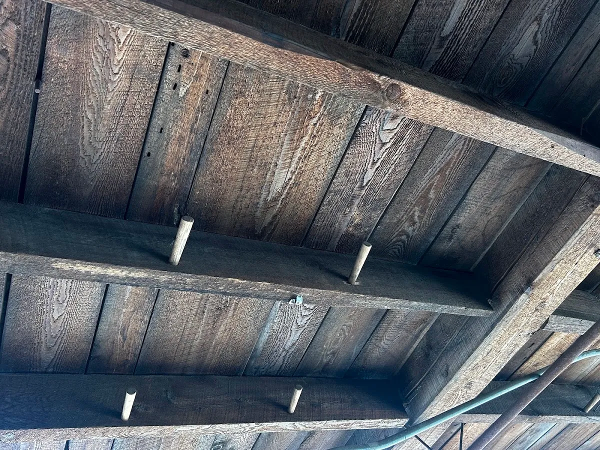 Weathered brown boards forming an old wood ceiling