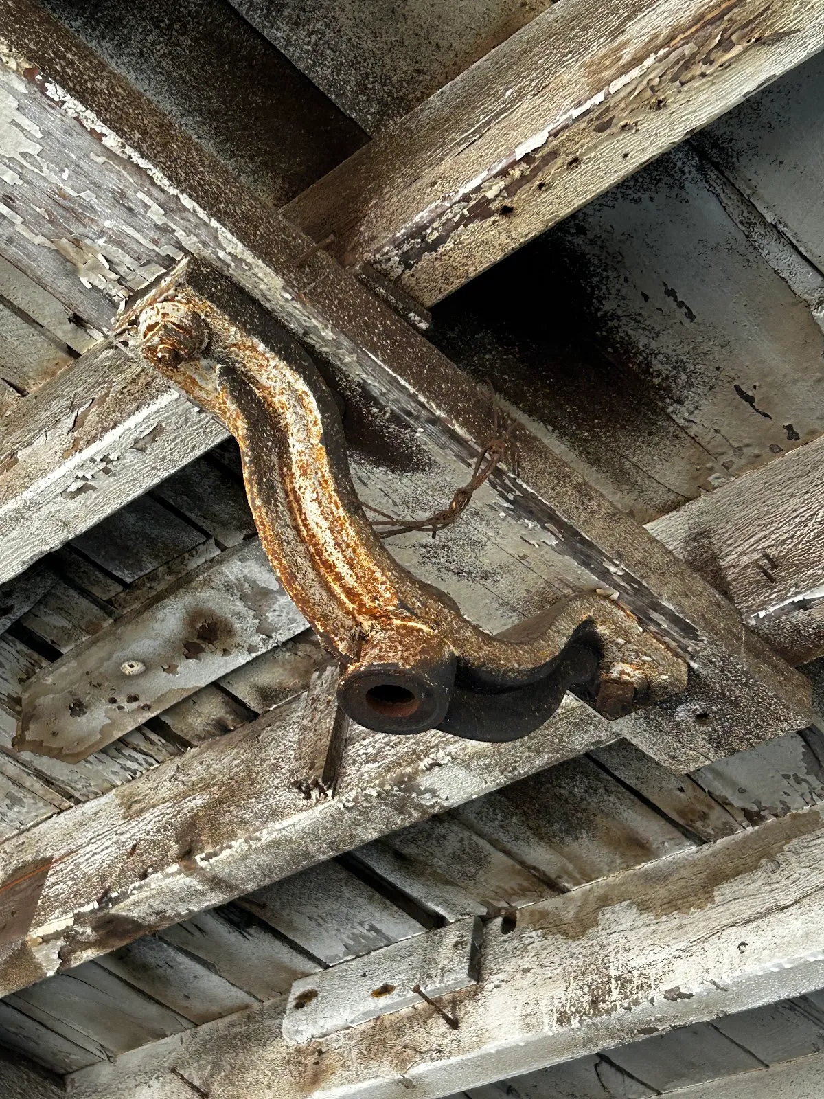 Weathered reclaimed rafters and decking pieces stacked together