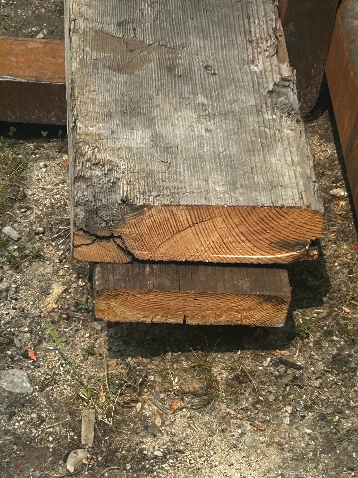 Stack of reclaimed rafter and decking boards in the yard