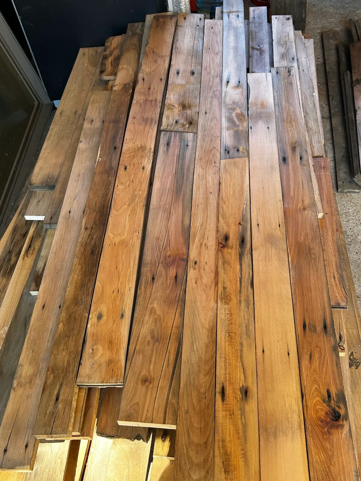 Many planed rock maple boards arranged side by side.