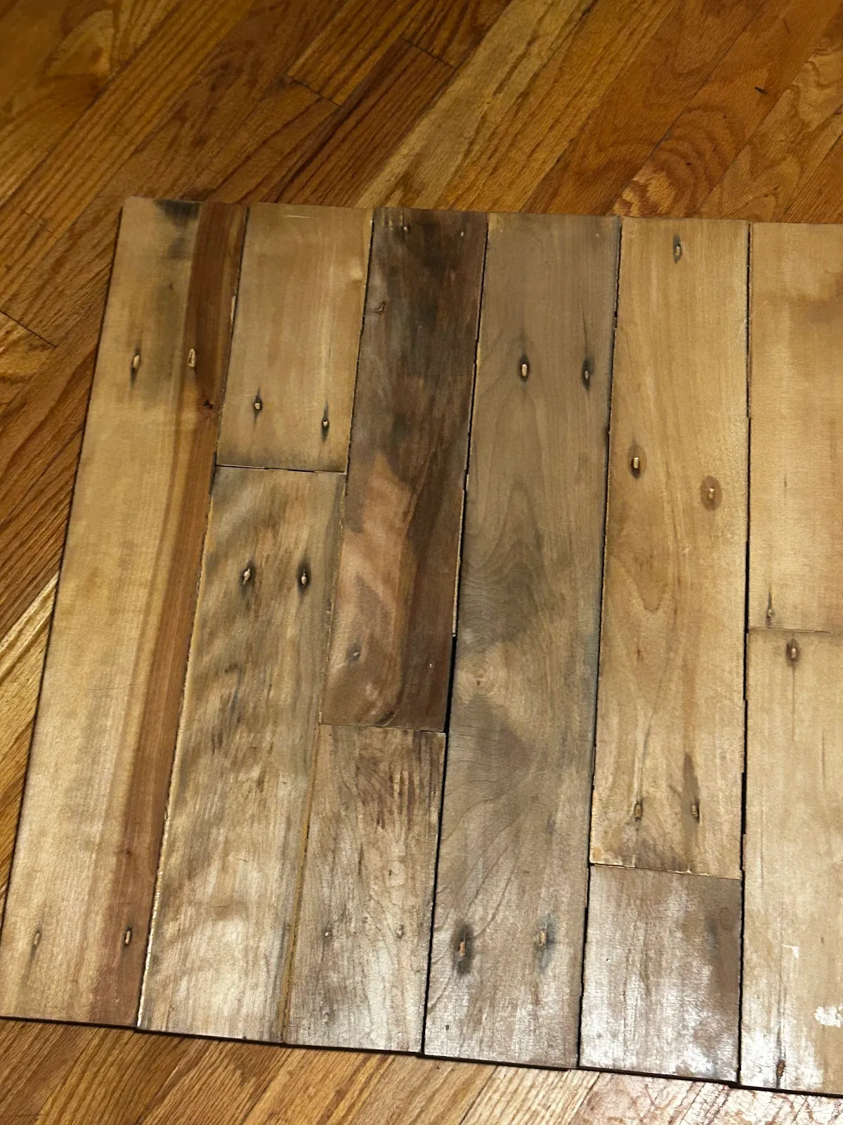 Several reclaimed sample boards arranged to show different surfaces