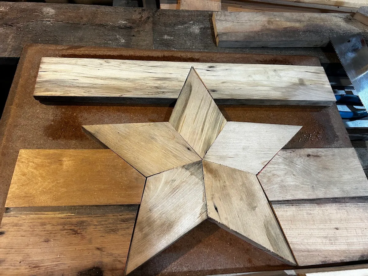 Reclaimed rock maple cutting board with a geometric star inlay