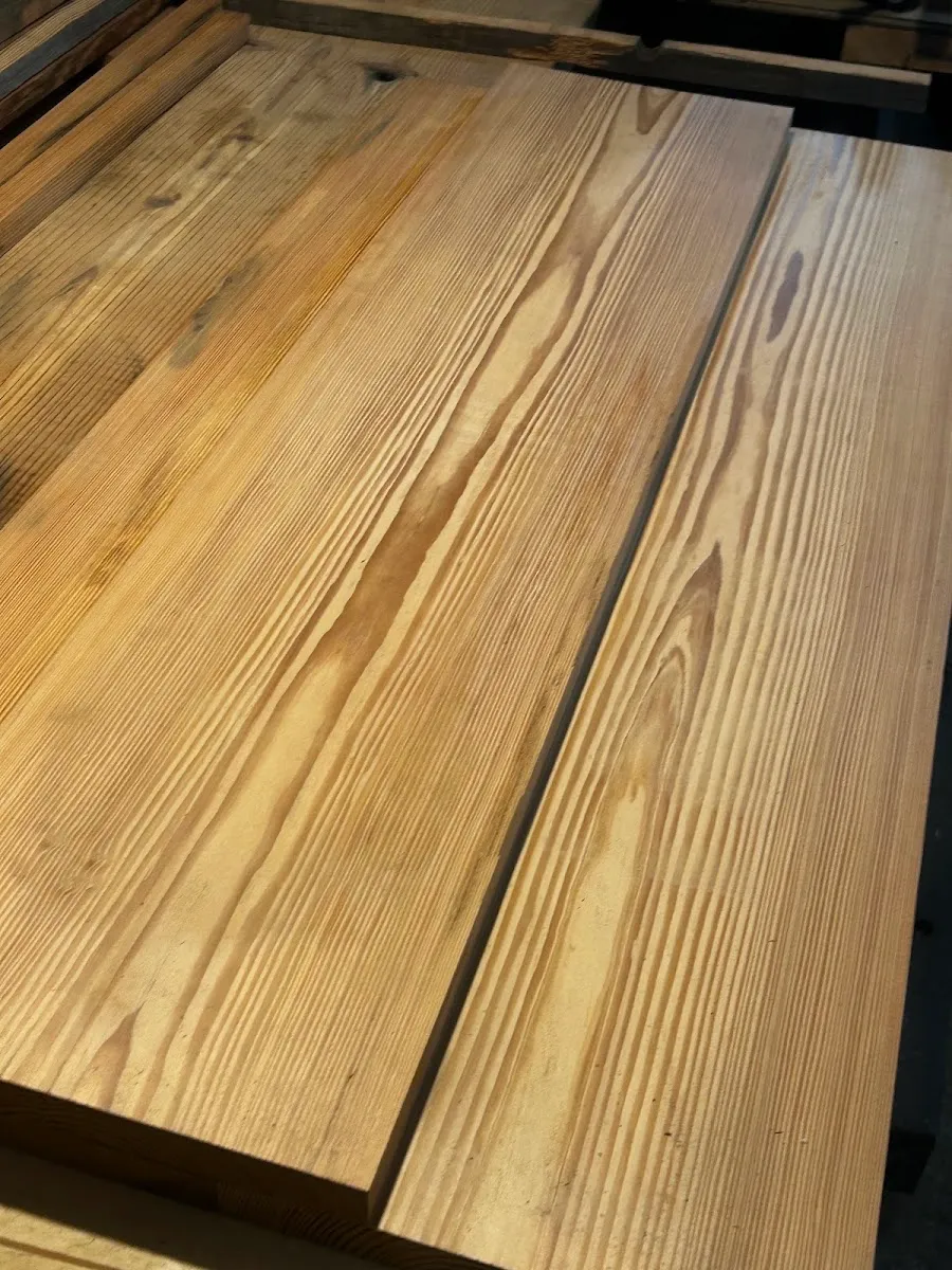 Heart pine boards laid side by side to compare grain and character