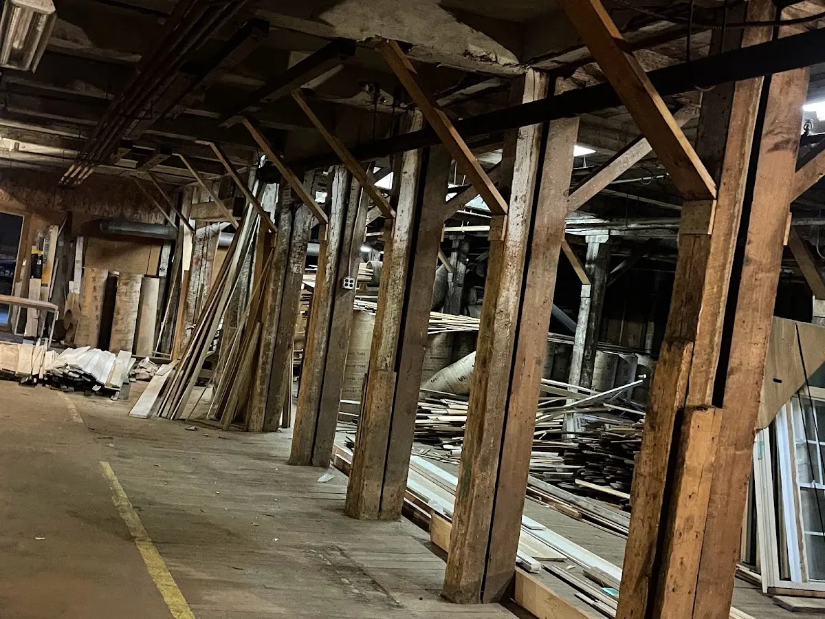 Rows of old wood posts and beams inside the toy factory